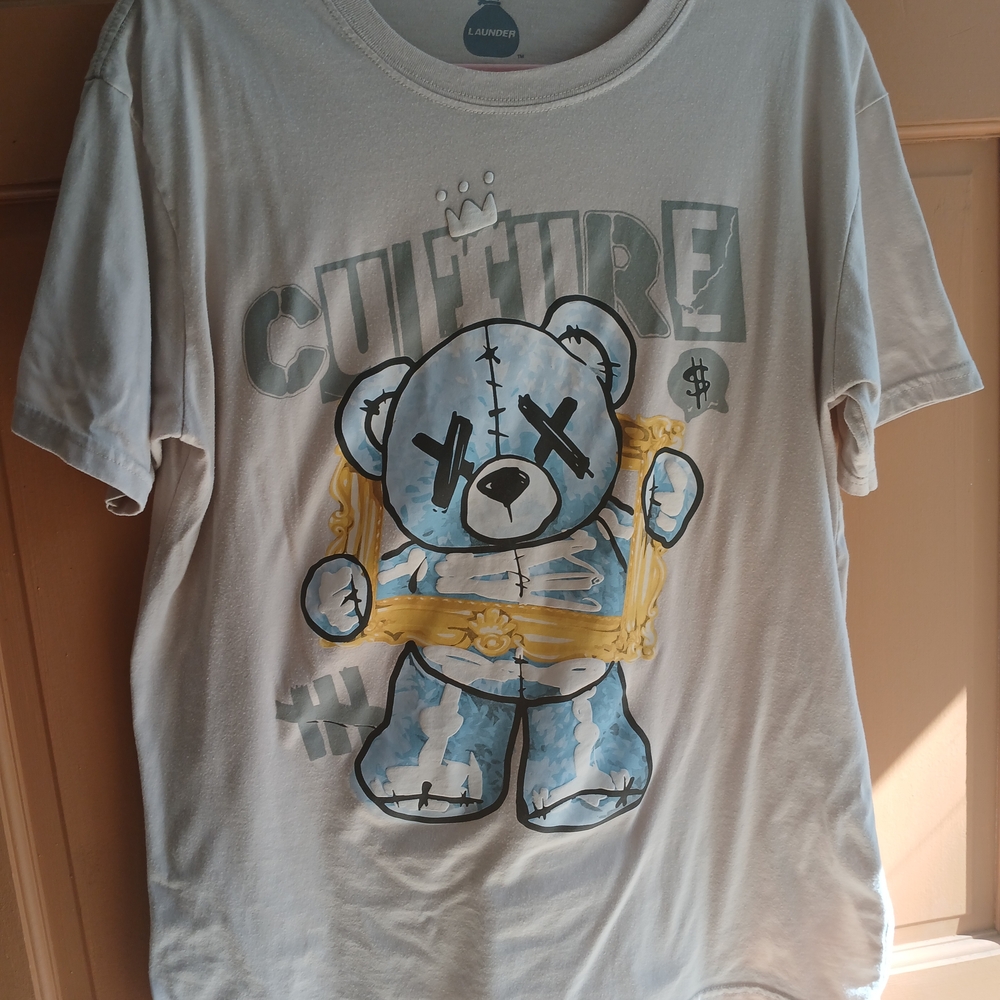 White Graphic Tee with Blue and Gold Bear Design